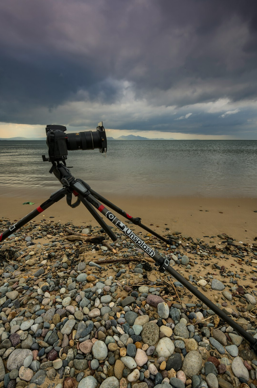 Video camera mounted on a tripod in a studio